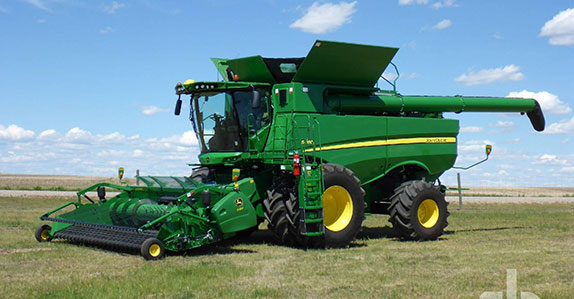 Pipelayers for sale. 2017 John Deere S680 combine sold at Ritchie Bros.