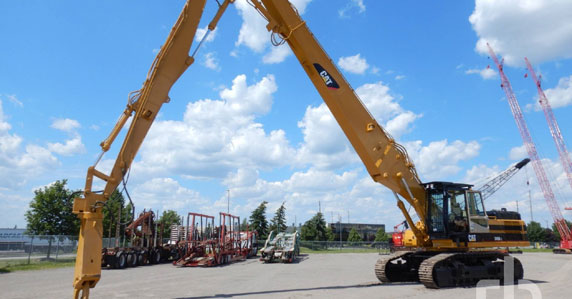 big ticket transportation 2001 Cat 345BL high reach demolition excavator sold by Ritchie Bros. Auctioneers